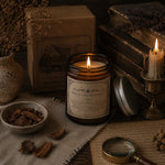 Load image into Gallery viewer, Pride and Prejudice candle with books, magnifying glass, and dried plants on a textured surface - Karsten &amp; Co. Australia
