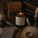 Load image into Gallery viewer, Pure Essential oil candle surrounded by books, a magnifying glass, and other vintage items on a wooden surface - Karsten &amp; Co. Australia
