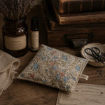 Load image into Gallery viewer, Vintage-style setting with lavender jar, floral heat pillow, and books on a wooden surface.
