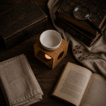 Load image into Gallery viewer, wooden oil burner in a Vintage setting with an open book, candle, and magnifying glass on a wooden surface Karsten &amp; Co. Australia

