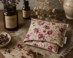 Load image into Gallery viewer, Floral-patterned lupin heat pack/pillow on a wooden surface with lavender and essential oil bottles - handmade by Karsten &amp; Co. Australia
