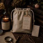 Load image into Gallery viewer, Heat pillow with label and candle on a wooden surface with books and flowers
