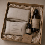 Load image into Gallery viewer, Gift set with lavender eye pillow, essential oils, and diffuser in a brown box.

