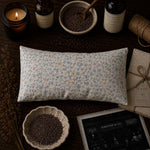 Load image into Gallery viewer, Floral-patterned lavender eye pillow on a wooden surface with bowls, candles, and bottles handmade in Australia - Karsten &amp; Co.
