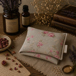 Load image into Gallery viewer, Floral-patterned fabric pouch on a wooden surface with dried flowers and herbs.
